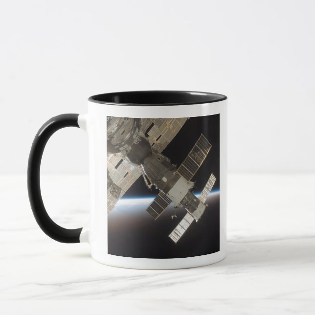 The docked Soyuz 13 Mug (Left)