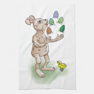 The Easter Bunny juggles with the Easter eggs Tea Towel