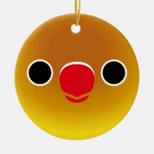 The face of a pastel green masked lovebird ceramic tree decoration