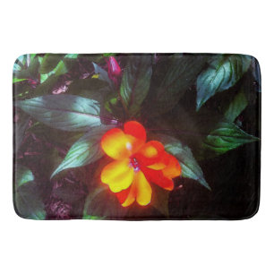 The Flower Glows in Sunlight Bath Mat