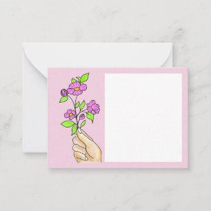 The flower in the lady's hand, the card to write