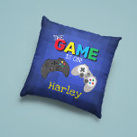 The Game Is On! | Video Game Cushion<br><div class="desc">Cool and colourful pillow,  that gamers will love. Featuring a blue pixel background,  two video game controlers,  the title "The Game is On!" and personalised with their name.</div>