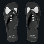 The Groom. Fun White Bow Tie & Buttons Wedding Jandals<br><div class="desc">These cute flip flops are perfect for the groom when he's ready to kick off his shoes and party. They feature a cute mock tuxedo design with a white bow tie and buttons at the top and his name and title below.</div>