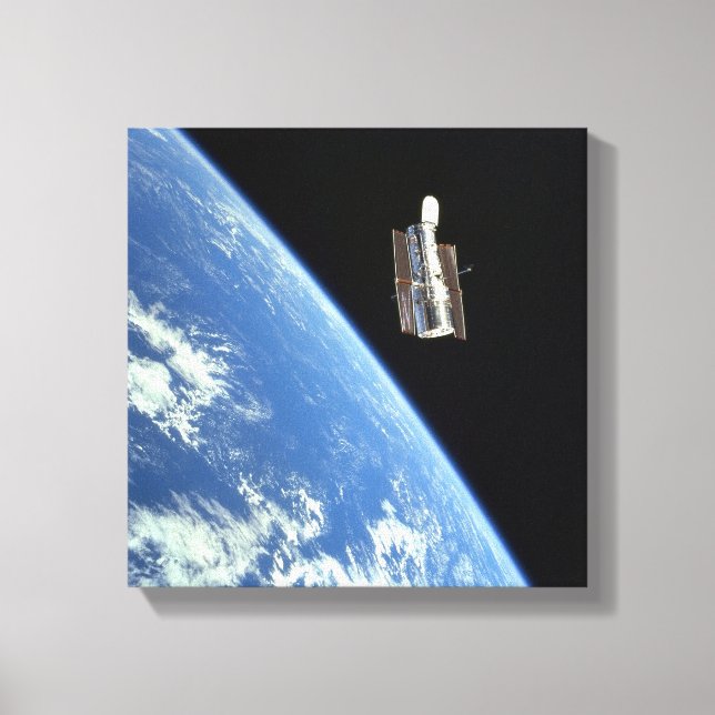 The Hubble Space Telescope with a blue earth Canvas Print (Front)