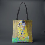 The Kiss, Gustav Klimt Tote Bag<br><div class="desc">Gustav Klimt (July 14, 1862 – February 6, 1918) was an Austrian symbolist painter and one of the most prominent members of the Vienna Secession movement. Klimt is noted for his paintings, murals, sketches, and other objets d'art. In addition to his figurative works, which include allegories and portraits, he painted...</div>