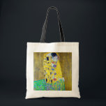 The Kiss, Gustav Klimt Tote Bag<br><div class="desc">Gustav Klimt (July 14, 1862 – February 6, 1918) was an Austrian symbolist painter and one of the most prominent members of the Vienna Secession movement. Klimt is noted for his paintings, murals, sketches, and other objets d'art. In addition to his figurative works, which include allegories and portraits, he painted...</div>