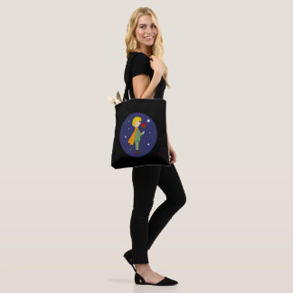 The little prince admiring his rose tote bag