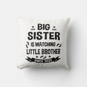 The little sister takes care of the big brother in cushion