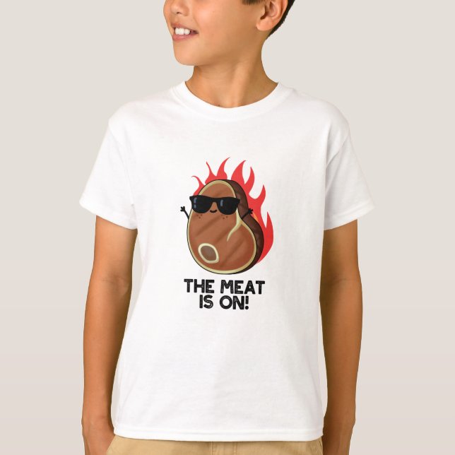 The Meat Is On Funny Food Steak Pun  T-Shirt (Front)