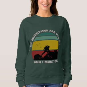 THE MOUNTAINS ARE CALLING AND I MUST GO HIKING SWEATSHIRT
