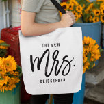 The New Mrs Personalised Bride Tote Bag<br><div class="desc">Show off your new last name with our super cute personalised bride tote! Modern black and white design features "the new  mrs. [lastname]" in handwritten script typography. Easily customise using the template field provided. Makes a great gift for a newlywed or recent bride.</div>