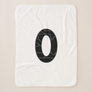The number zero (0) in black sherpa blanket
