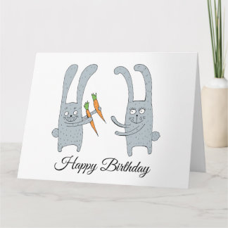 The rabbit gives the hare a carrot for his birthda card