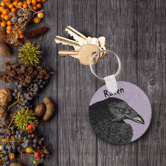 The Raven Keychain (Head face of crow or raven in black on marbled purple keychain.)