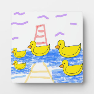 The Red Lighthouse and the Yellow Duck Pier Plaque