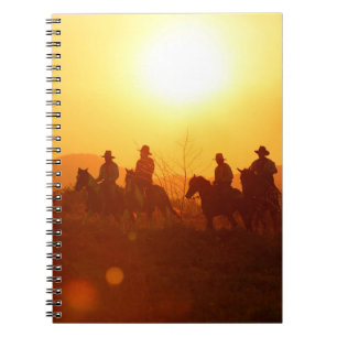 The silhouette of rider as cowboy outfit costume w notebook