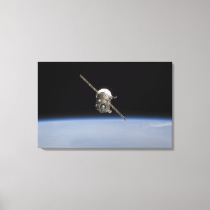 The Soyuz TMA-11 spacecraft above Earth's horiz Canvas Print