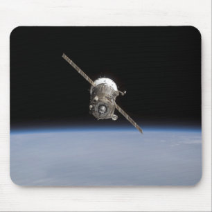 The Soyuz TMA-11 spacecraft above Earth's horiz Mouse Pad