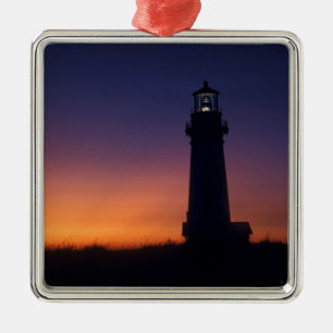 The sun ball drops down on the colourful horizon metal tree decoration