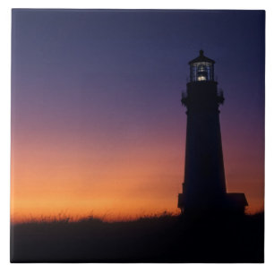 The sun ball drops down on the colourful horizon tile