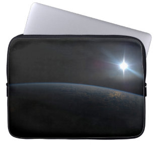 The Sun Setting Over Earth's Horizon. Laptop Sleeve