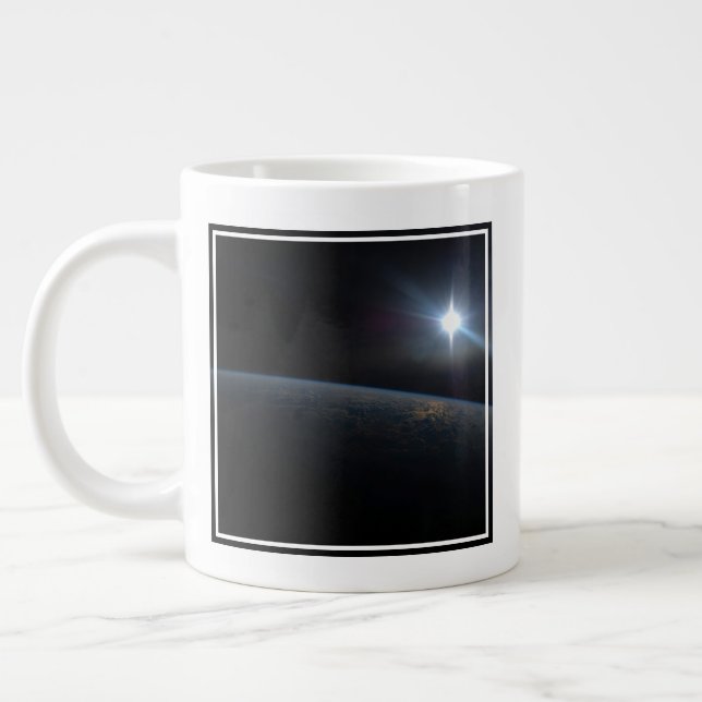 The Sun Setting Over Earth's Horizon. Large Coffee Mug (Left)