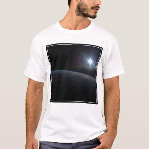 The Sun Setting Over Earth's Horizon. T-Shirt