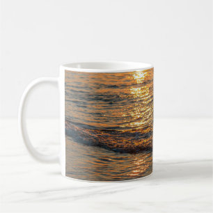The sunset reflection on the beautiful ocean water coffee mug