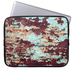 The texture of a rusty iron and a blue strongly pe laptop sleeve