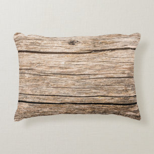 The texture of an old wooden log without bark with decorative cushion