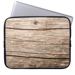 The texture of an old wooden log without bark with laptop sleeve