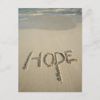 The word 'Hope' sand written on the beach with Postcard