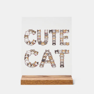 The words "CUTE CAT" are made using cat faces Acrylic Sign