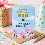 Therapy Degree Funny Mum Birthday Card<br><div class="desc">Therapy Degree Funny Mum Birthday Card. Celebrate your amazing mum's special day with a laugh! This humourous birthday card features the message 'Happy Birthday MOM, You Deserve a Therapy Degree, ' perfectly capturing her endless patience. Stylish graduation cap, bold gold lettering, and pink cosmos flowers against a blue sky, it's...</div>