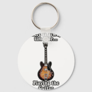 There is always time for playing the guitar. retro key ring