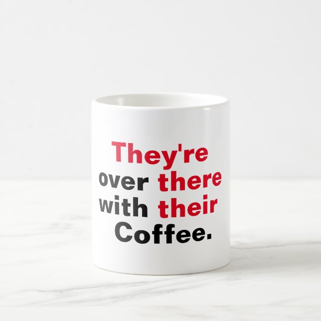 They're over there with their coffee mug (Center)