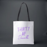 THIRTY AF Personalised Funny 30th Birthday Tote Bag<br><div class="desc">Celebrate turning 30 in bold style with this personalised “THIRTY AF” tote bag. Featuring vibrant purple text and your custom name in elegant script, this playful yet practical bag is perfect for birthday brunches, party essentials, or gift-giving flair. Whether you’re treating yourself or surprising your bestie, this tote adds sass...</div>