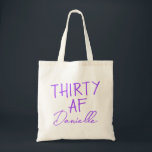 THIRTY AF Personalised Funny 30th Birthday Tote Bag<br><div class="desc">This personalised “THIRTY AF” tote bag is the ultimate 30th birthday accessory — bold, fun, and fabulously functional. Featuring a custom name in elegant vibrant purple script beneath the playful slogan, it’s perfect for brunches, gifting, errands, or that post-party coffee run. Made for birthdays with attitude, this bag is as...</div>