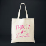 THIRTY AF Personalised Funny 30th Birthday Tote Bag<br><div class="desc">This personalised “THIRTY AF” tote bag is the ultimate 30th birthday accessory — bold, fun, and fabulously functional. Featuring a custom name in elegant vibrant pink script beneath the playful slogan, it’s perfect for brunches, gifting, errands, or that post-party coffee run. Made for birthdays with attitude, this bag is as...</div>