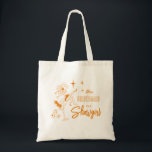 This Bridesmaid is a Show Girl Bachelorette Party Tote Bag<br><div class="desc">Turn up the glitz and get ready for one unforgettable night in true Vegas style! This playful, hand-illustrated customized bridesmaid tote bag features a bold orange color scheme, blending retro showgirl flair with whimsical Las Vegas-inspired casino doodles—think sparkling showgirl silhouettes, dice, cards, bright marquee lights, and starry desert skies. Perfect...</div>