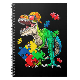 This dinosaur autism awareness top features a dino notebook