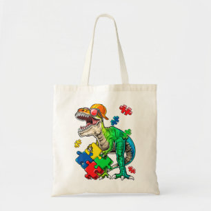 This dinosaur autism awareness top features a dino tote bag