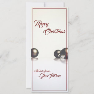 Three christmas balls in front of light background