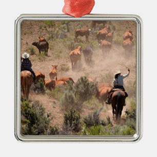 Three cowboys and cowgirls driving cattle metal tree decoration