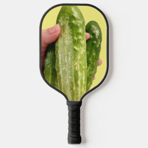 Three Cucumbers on Yellow Pickleball Paddles