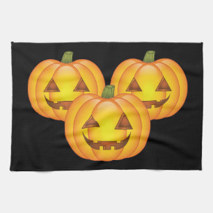 Three Cute Halloween Jack O’Lantern Pumpkins Tea Towel