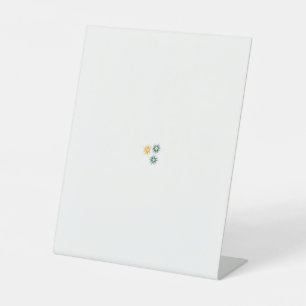 three flowers with green and orange petals pedestal sign
