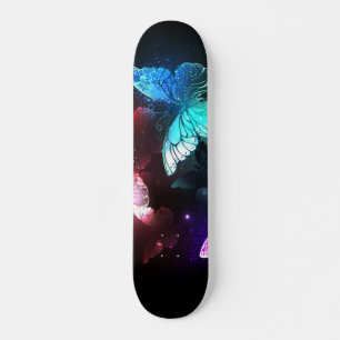 Three Glowing Butterflies on night background Skateboard