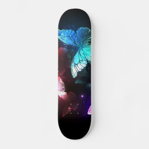 Three Glowing Butterflies on night background Skateboard