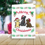Three Labradors and Ornaments Christmas Holiday Card<br><div class="desc">Three Labradors and Ornaments Christmas Holiday Card for Labrador Retriever Owners.  Very cute Labrador Retriever cartoon design featuring three Labradors enjoy Santa Hats and Ornaments.  Yellow Labrador Retriever and Black Labrador Retriever and Chocolate Labrador Retriever are painted.  Mischievous Labrador expressions and red and green colours make festive feelings.</div>